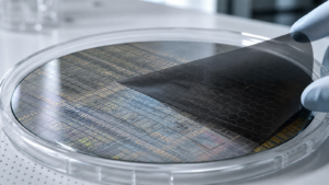 Concept image: atomically thin graphene layer over a patterned semiconductor wafer.