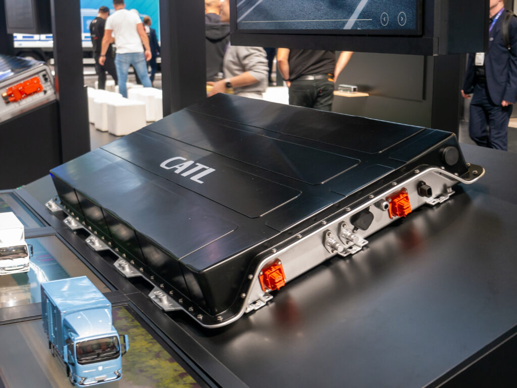 Enclosed CATL battery pack with orange side connectors on display at IAA Transportation 2024 in Hanover.